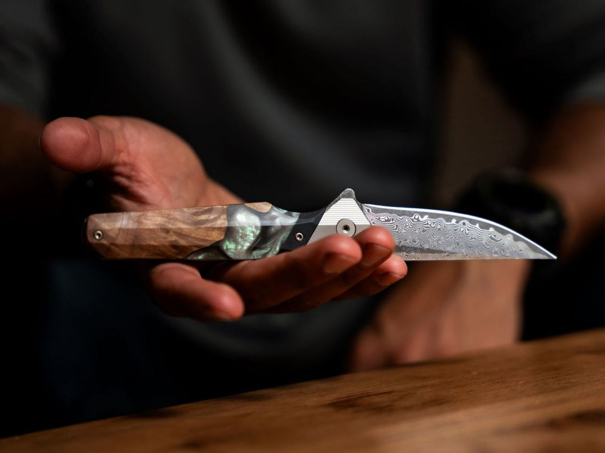 Carved Live Edge Knife in someones hand